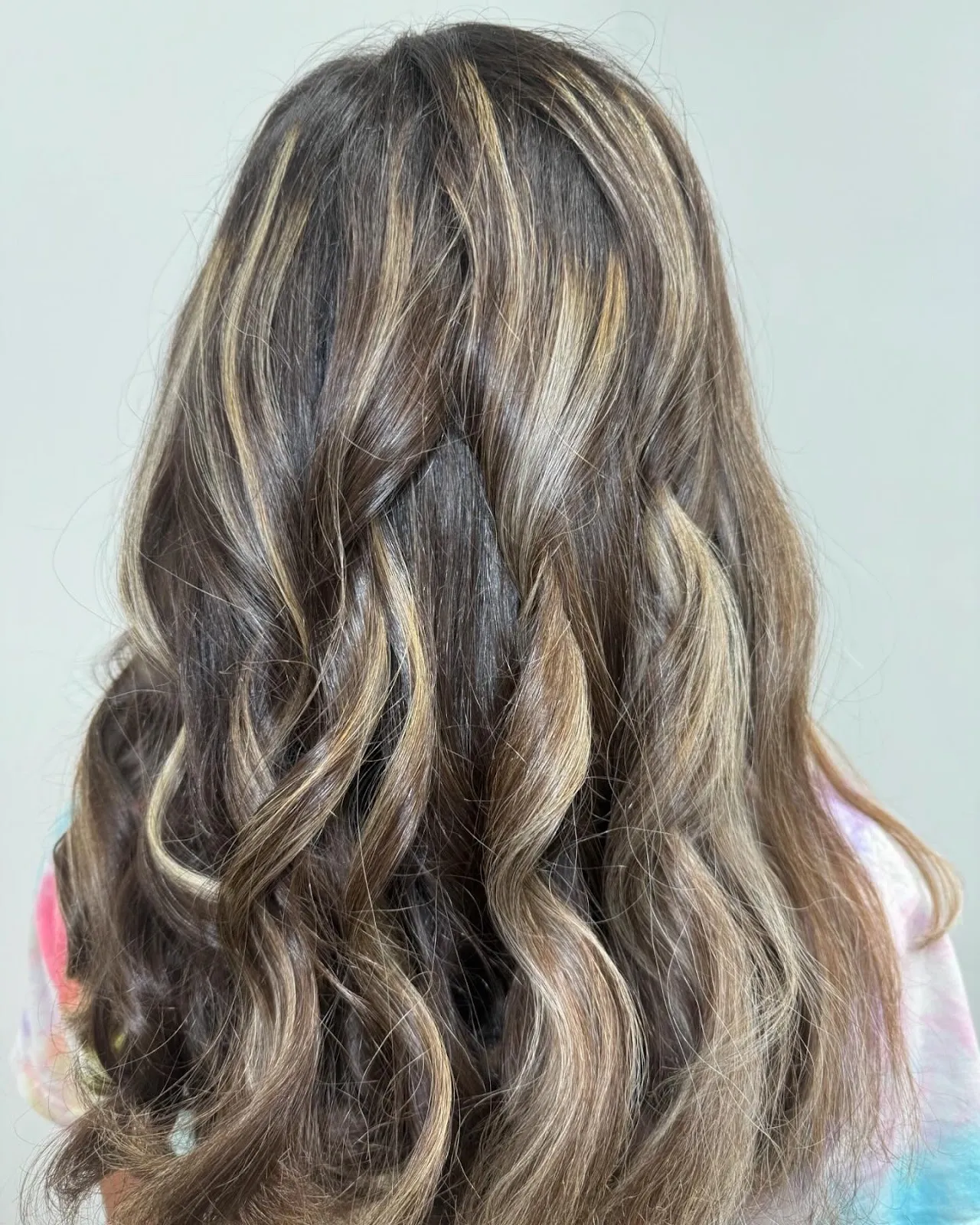 Dimensional brunette highlights by Erica